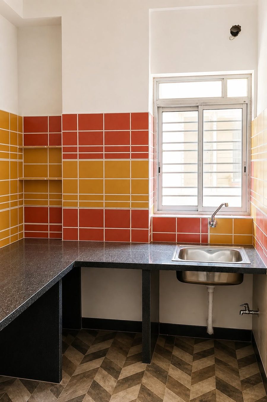 Newly finished kitchen with red and yellow wall tiles at Krishna Shivangan, Kestopur